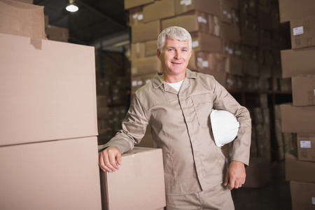 Portrait of a confident worker smiling in the warehouse