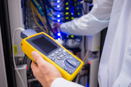 Close-up of a digital cable analyser in a large data center