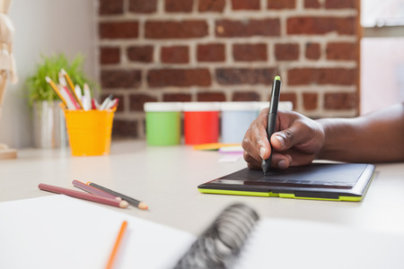 Designer sketching on graphics tablet in the officeの写真素材