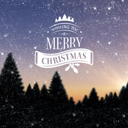 Christmas message against snow falling on fir tree forestの写真素材