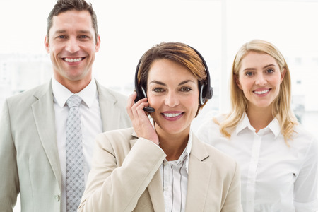 Portrait of happy young business people in the officeの写真素材