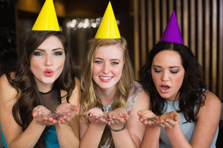 Attractive friends celebrating a birthday at the barの写真素材