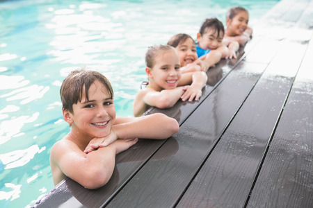 Cute swimming class in the pool at the leisure centerの写真素材