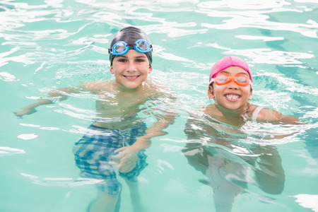 Cute swimming class in the pool at the leisure centerの写真素材