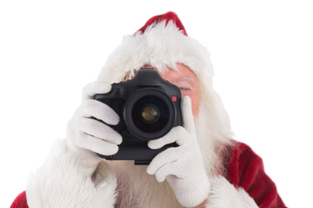 Santa is taking a picture on white backgroundの写真素材