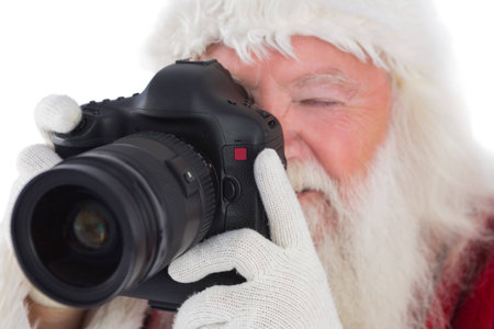 Santa is taking a picture on white backgroundの写真素材
