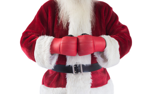 Santa Claus wears boxing gloves on white backgroundの写真素材