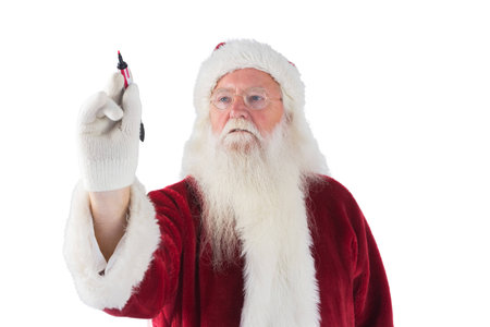Santa writes something with a pen on white backgroundの写真素材