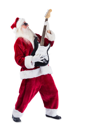 Santa Claus plays guitar with sunglasses on white backgroundの写真素材