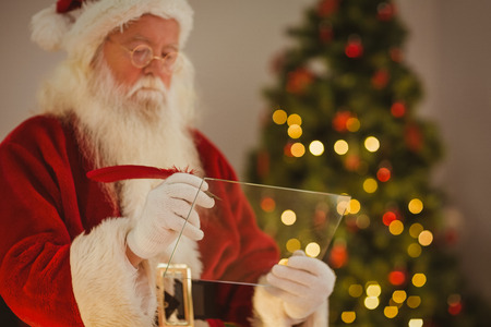Father christmas writing list on the glass at home in the living roomの写真素材