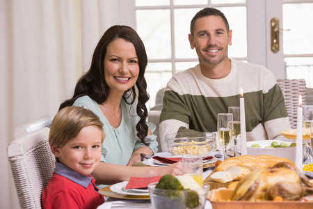 Smiling family during christmas dinner at home in the living room