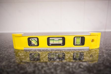 Spirit level on the counter in the kitchenの写真素材