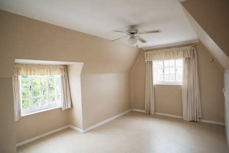 Empty master bedroom in cream and beige in a new house