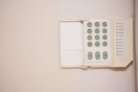 Close up of home security keypad on the wall