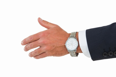 Businessman in suit offering handshake on white backgroundの写真素材
