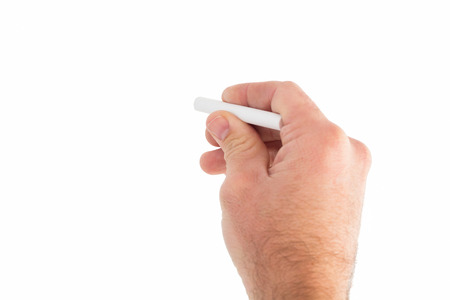 Business man writing with chalk on white backgroundの写真素材