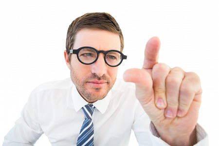 Businessman pointing with his finger on white backgroundの写真素材