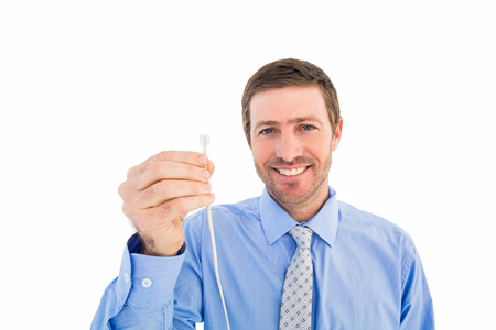 Businessman holding a cable on white backgroundの写真素材
