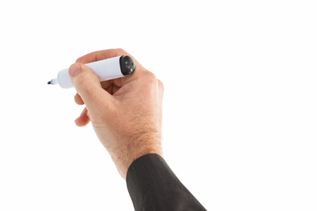Businessmans hand writing with marker on white backgroundの写真素材