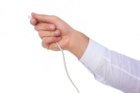 Close up of businessmans hand holding cable on white background