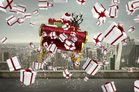 White and red christmas presents against balcony overlooking cityの写真素材