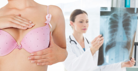 Composite image of closeup of woman performing self breast examinationの写真素材