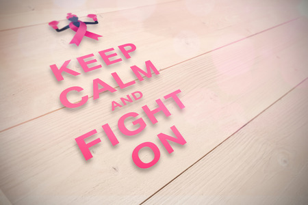 Breast cancer awareness message against bleached wooden planks backgroundの写真素材