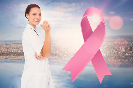 Doctor with breast cancer awareness message for awareness monthの写真素材
