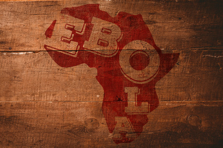 Red ebola text on africa outline against overhead of wooden planksの写真素材