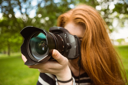 Close up of female photographer at the park