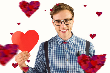 Geeky hipster holding a heart card against heartsの写真素材
