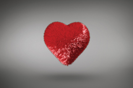 Red heart against grey vignetteの写真素材