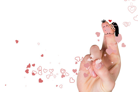 Fingers crossed like a couple against valentines heart designの写真素材