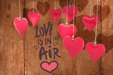 love is in the air against wooden planksの写真素材