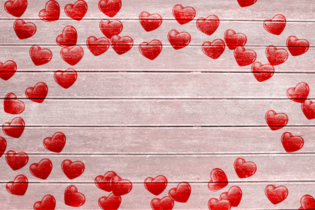 Red love hearts against wooden surface with planksの写真素材
