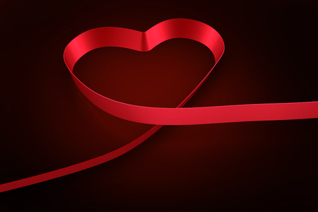 Red ribbon heart against red background with vignetteの写真素材