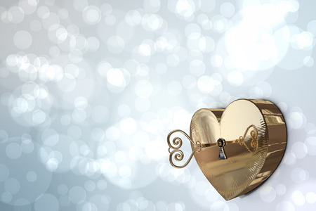 Golden heart lock against light glowing dots design patternの写真素材