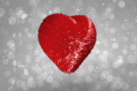 Red heart against grey abstract light spot designの写真素材