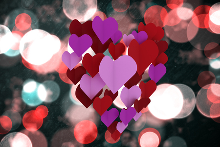 Love hearts against digitally generated twinkling light designの写真素材