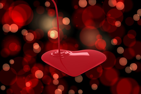 Liquid heart pouring against red glowing dots on blackの写真素材