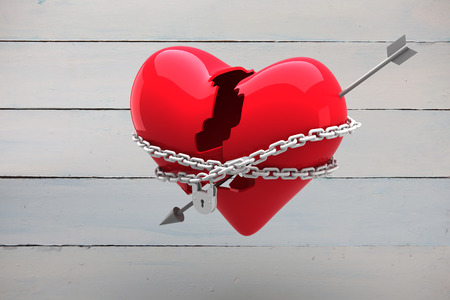 Locked heart against painted blue wooden planksの写真素材