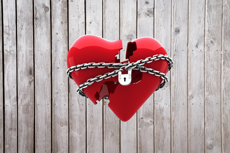 Locked heart against digitally generated grey wooden planksの写真素材
