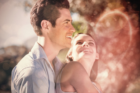 Side view of a loving and happy young couple at the parkの写真素材