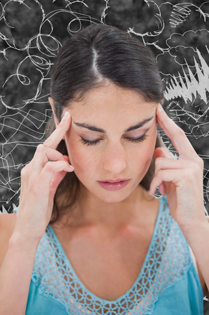 Woman with headache against messy cloud doodleの写真素材