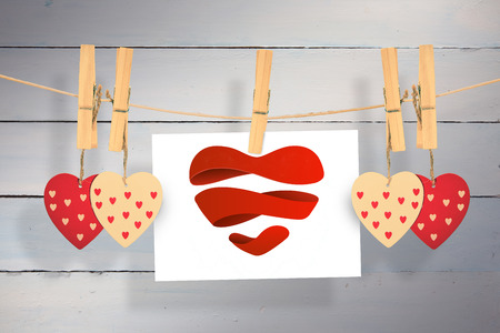 Heart against painted blue wooden planksの写真素材