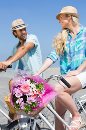 Cute couple on a bike ride on a sunny dayの写真素材