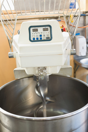 Industrial mixer on counter in the kitchen of the bakeryの写真素材