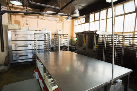 No one in the room in the kitchen of the bakery