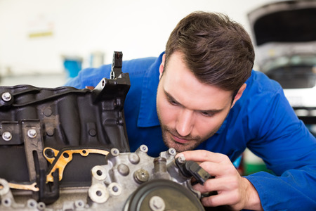 Mechanic working on an engine at the repair garage