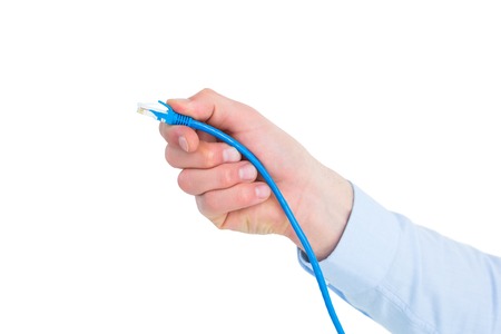 Businessman in shirt holding a cable on white backgroundの写真素材